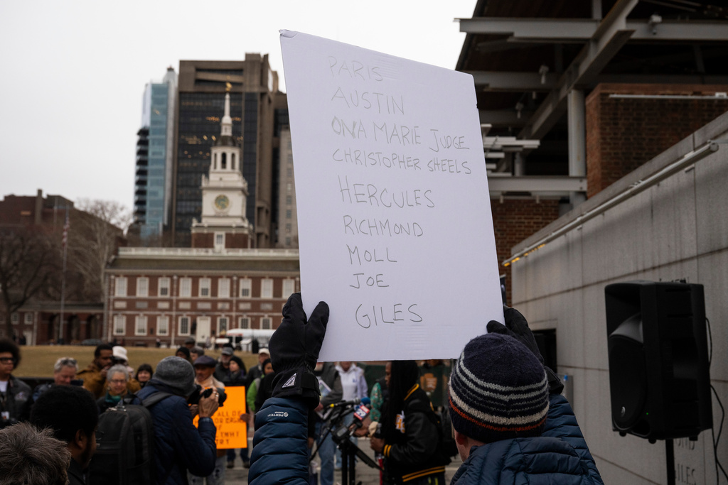 Attendees gather for a rally celebrating the reinstallation of a slavery exhibit at the President's House Site in Philadelphia on Thursday, Feb. 19, 2026, in Philadelphia. (AP Photo/Joe Lamberti)