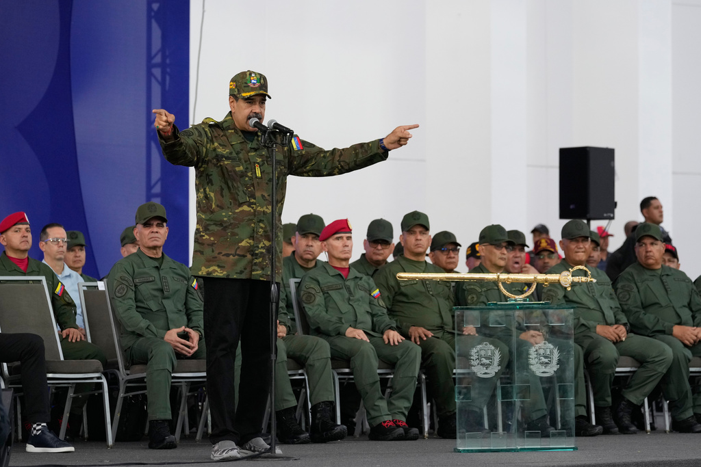 Venezuelan President Nicolas Maduro speaks during a civic-military event at the military academy in Caracas, Venezuela, Tuesday, Nov. 25, 2025. (AP Photo/Ariana Cubillos)