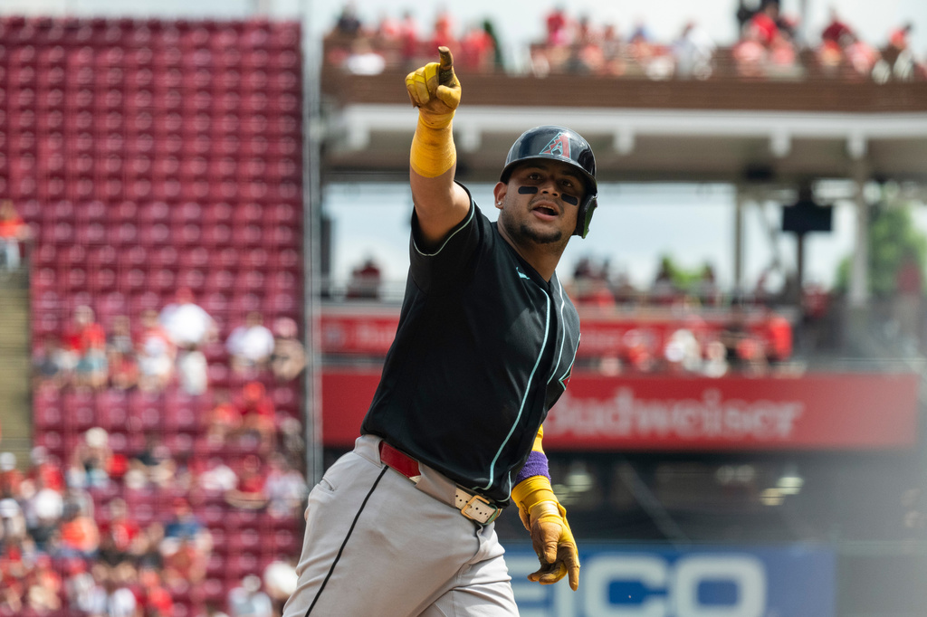 Arizona Diamondbacks' Gabriel Moreno gestures after hitting a home run in the eighth inning of a baseball game against the Cincinnati Reds, Sunday, June 14, 2026, in Cincinnati. (AP Photo/Michael Swensen)