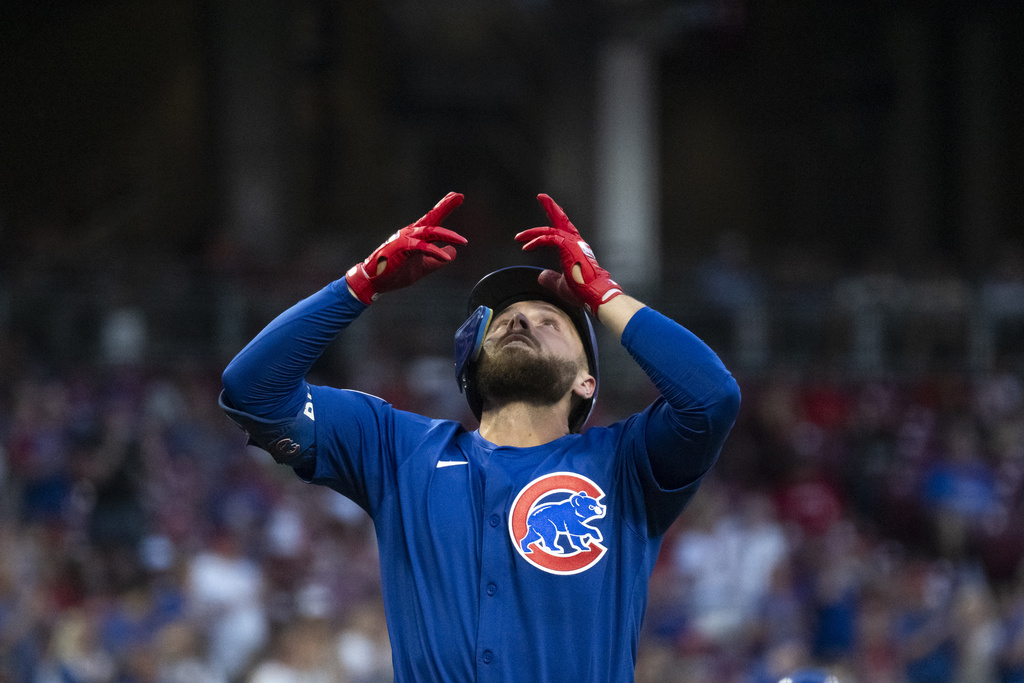 Chicago Cubs' Michael Busch celebrates after hitting a home run in the third inning of a baseball game against the Cincinnati Reds, Saturday, Sept. 20, 2025, in Cincinnati. (AP Photo/Michael Swensen)
