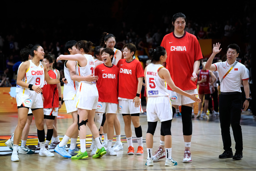 China players celebrate after the Women's Basketball World Cup match between Czechia and China in Berlin, Sunday, Sept. 6, 2026. (AP Photo/Ebrahim Noroozi)