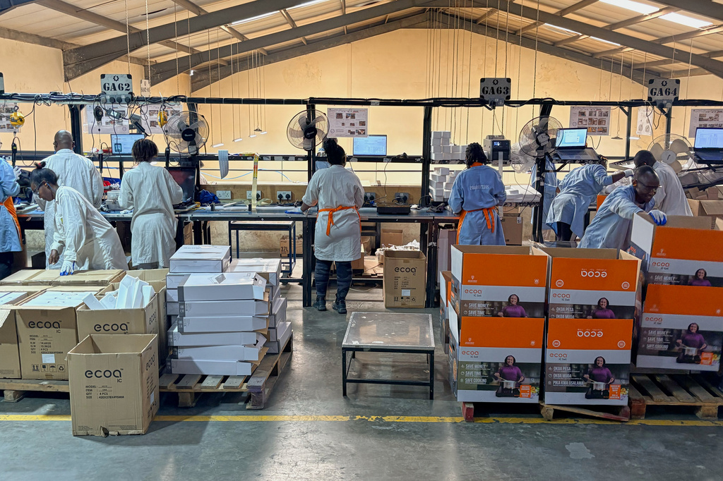 Workers assemble fuel-efficient cookstoves at BURN, a manufacturer of clean cooking appliances, in Kiambu, Kenya, on July 31, 2026. (AP Photo/Allan Olingo)