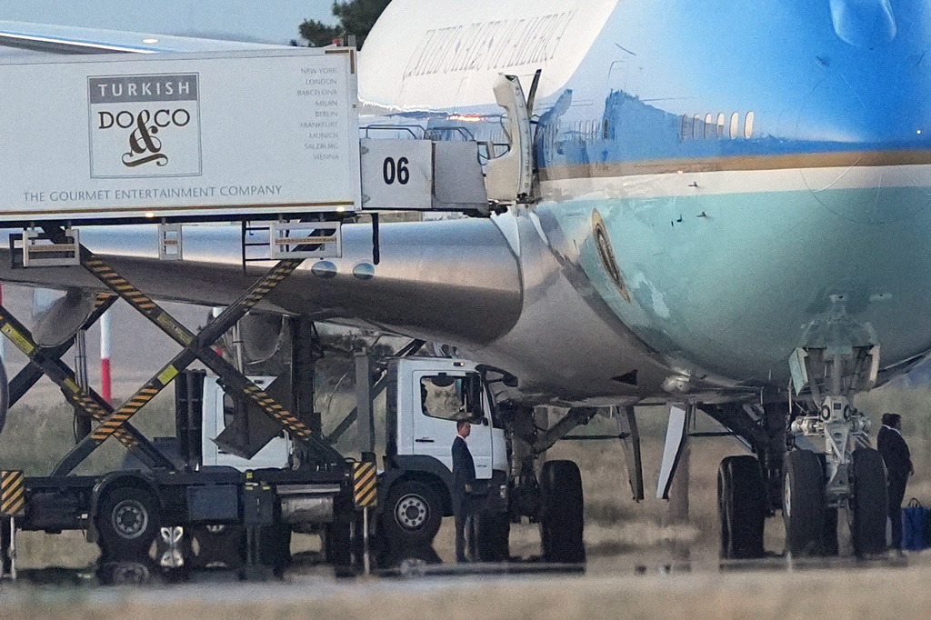 Catering trucks are parked at Air Force One on the tarmac as the motorcade carrying U.S. President Donald Trump arrives to depart following the NATO summit at Ankara International Airport in Ankara, Turkey, Wednesday, July 8, 2026. (AP Photo/Alex Brandon)