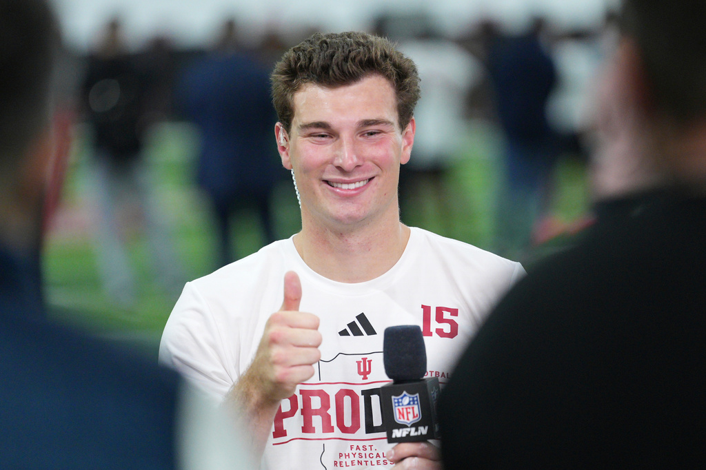 Indiana quarterback Fernando Mendoza gives a thumbs up after an interview with NFL Network at the school's NFL football pro day Wednesday, April 1, 2026, in Bloomington, Ind. (AP Photo/AJ Mast)