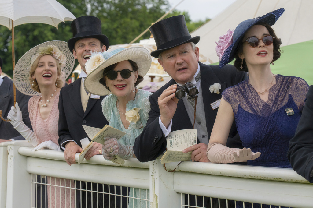This image released by Focus Features shows Laura Carmichael, from left, Harry Hadden-Paton, Elizabeth McGovern, Hugh Bonneville and Michelle Dockery in a scene from "Downton Abbey: The Grand Finale." (Focus Feature via AP)