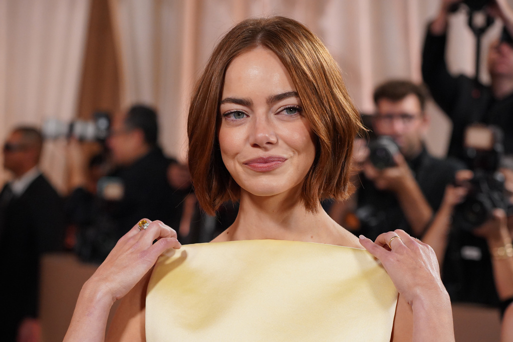 Emma Stone arrives at the 83rd Golden Globes on Sunday, Jan. 11, 2026, at the Beverly Hilton in Beverly Hills, Calif. (Photo by Jordan Strauss/Invision/AP)