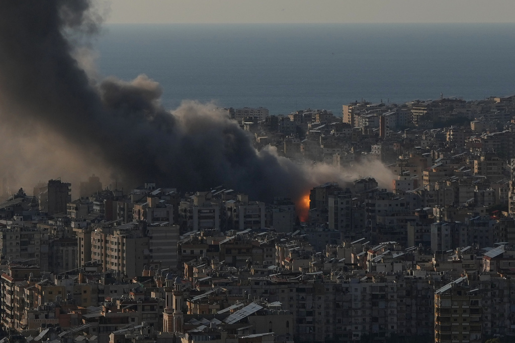 Flames and smoke rise following Israeli airstrikes on Dahiyeh, a southern suburb of Beirut, Lebanon, Monday, March 2, 2026. (AP Photo/Hassan Ammar)