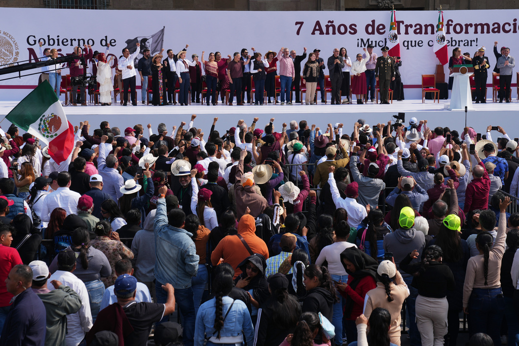 Mexican President Claudia Sheinbaum addresses supporters during a celebration marking the seven years of the Fourth Transformation movement, or 4T, initiated by former Mexican President Andrés Manuel López Obrador, in the Zócalo of Mexico City, Saturday, Dec. 6, 2025. (AP Photo/Marco Ugarte)
