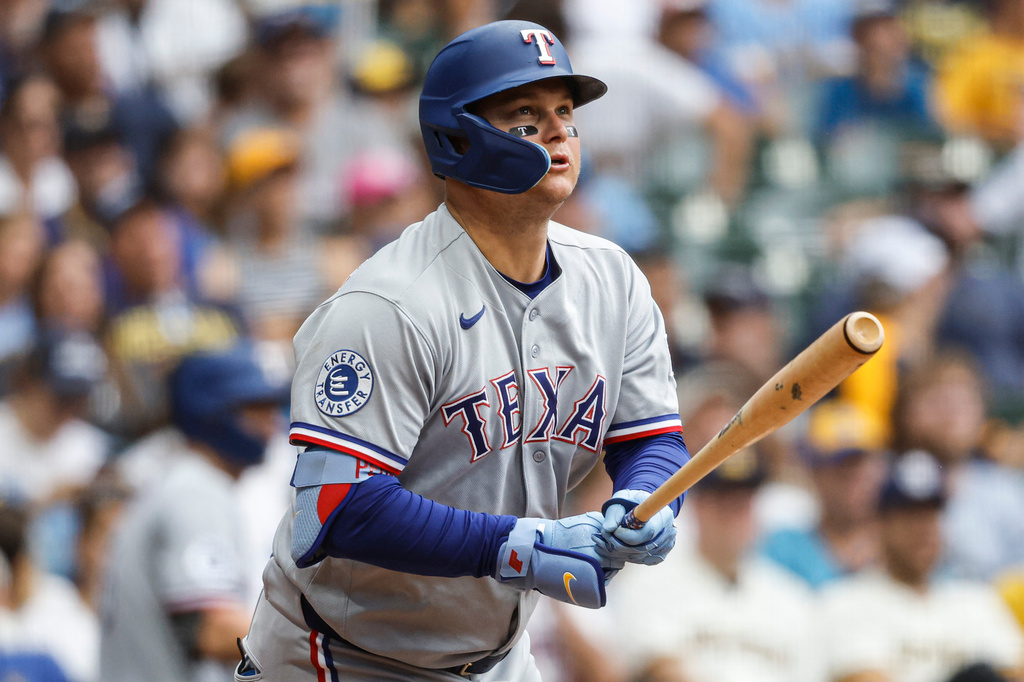 Texas Rangers' Joc Pederson watches his home run against the Milwaukee Brewers during the sixth inning of a baseball game Sunday, Aug. 30, 2026, in Milwaukee. (AP Photo/Jeffrey Phelps)