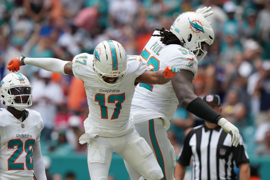 Miami Dolphins' Jaylen Waddle celebrates a touchdown during the first half of an NFL football game against the Buffalo Bills, Sunday, Nov. 9, 2025, in Miami Gardens, Fla. (AP Photo/Lynne Sladky)