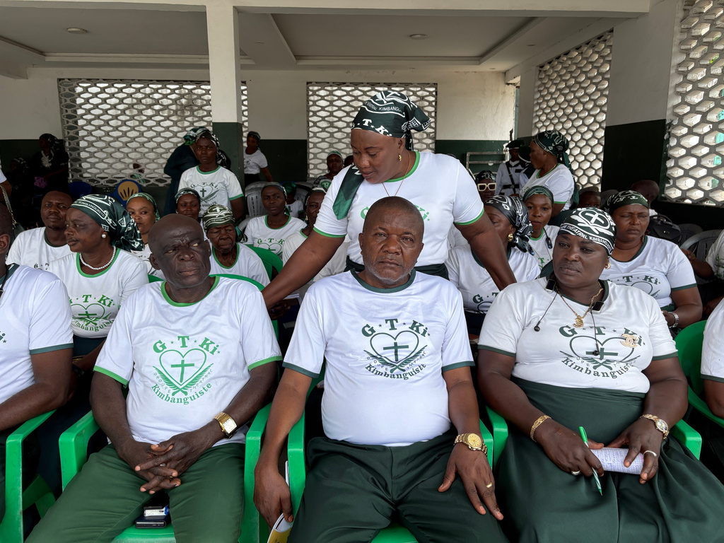 Kimbanguist Church members attend Easter Sunday service at a reception center for the faithful in Kinshasa, Democratic Republic of the Congo, Sunday, April 5, 2026. (AP Photo/Rodney Muhumuza)