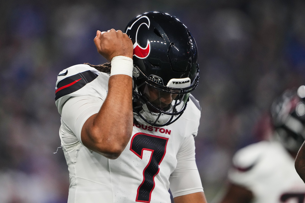 Houston Texans' C.J. Stroud (7) walks off the field after being sacked in the first half of an NFL football game against the Seattle Seahawks Monday, Oct. 20, 2025, in Seattle. (AP Photo/Lindsey Wasson)