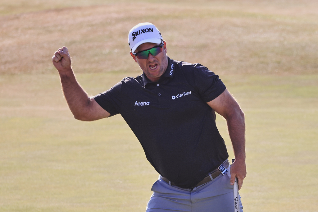 Ryan Fox of New Zealand celebrates on the 18th green after winning the British Open Golf championships at Royal Birkdale golf club, in Southport, England, Sunday, July 19, 2026. (AP Photo/Peter Morrison)