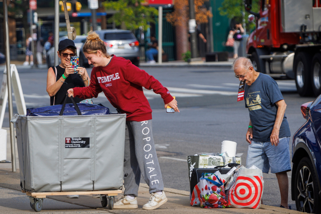 FILE - Emily Danenhower, 17, loads her container as grandparents Rena Ruben and Walter McClain help move her into college as students moved into their dorms during move-in-day at Temple University in Philadelphia, on Monday, Aug. 21, 2023. (Alejandro A. Alvarez/The Philadelphia Inquirer via AP, File)