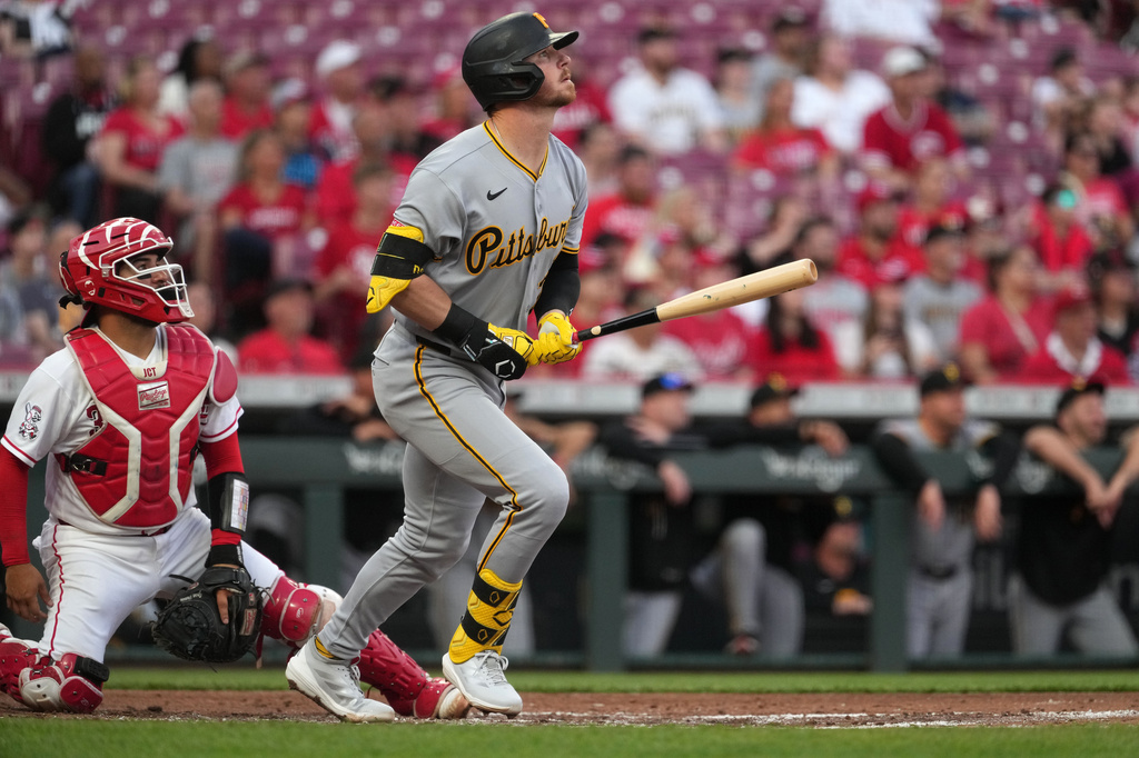 Pittsburgh Pirates' Ryan O'Hearn follows through after hitting a three-run home run during the second inning of a baseball game against the Cincinnati Reds, Tuesday, March 31, 2026, in Cincinnati. (AP Photo/Kareem Elgazzar)