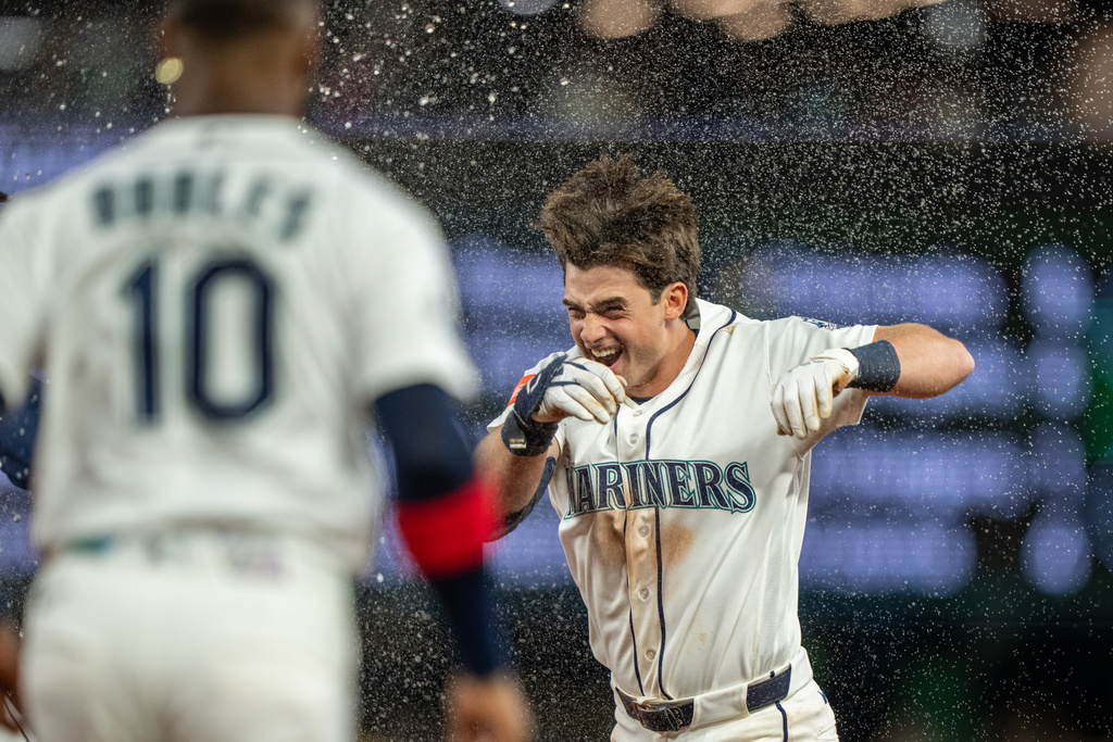 Seattle Mariners' Cole Young celebrates after a baseball game against the New York Mets, Monday, June 1, 2026, in Seattle. (AP Photo/Stephen Brashear)