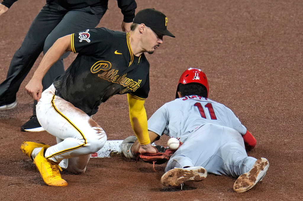 St. Louis Cardinals' Victor Scott II (11) steals second base as the ball gets away from Pittsburgh Pirates shortstop Konnor Griffin during the seventh inning of a baseball game in Pittsburgh, Wednesday, April 29, 2026. (AP Photo/Gene J. Puskar)
