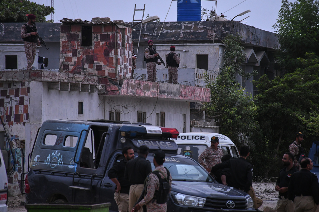 Paramilitary soldiers examine a damaged area after a militant attack at the provincial headquarters of the paramilitary Pakistan Rangers in Karachi, Pakistan, Sunday, June 28, 2026. (AP Photo/Ali Raza)