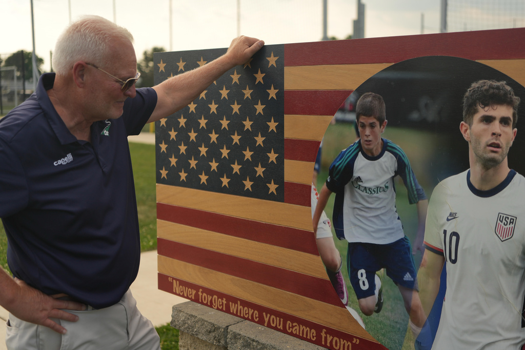Pennsylvania Classic co-founder and president, Doug Harris, looks at a banner of U.S. national team soccer player, Christian Pulisic, who was born in nearby Hershey, and honed his skills at the club in Manheim, Pa., on Monday, June 29, 2026. (AP Photo/Luis Andres Henao)