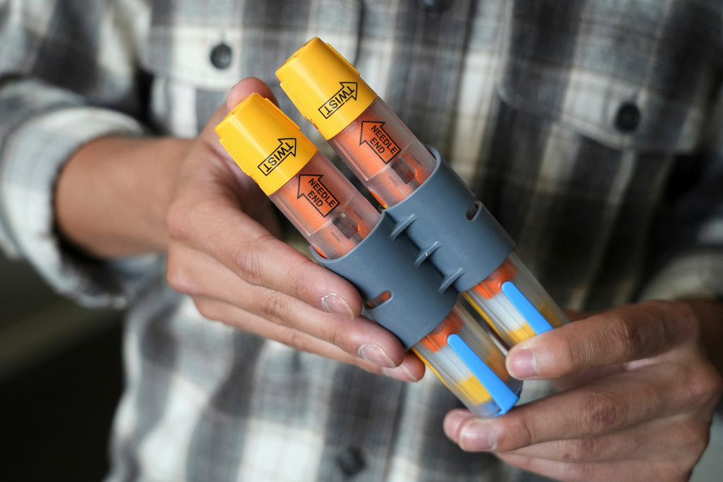 FILE - Braxton Kimura shows his EpiPens at home on Aug. 13, 2025, in San Jose, Calif. (AP Photo/Terry Chea, File)