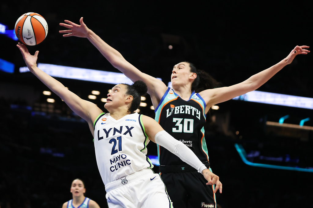 Minnesota Lynx guard Kayla McBride (21) drives to the basket past New York Liberty forward Breanna Stewart (30) during the first half of Game 2 of a WNBA basketball first-round playoff series, Tuesday, Sept. 29, 2026, in New York. (AP Photo/Heather Khalifa)