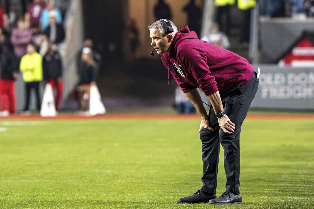 Florida State head coach Mike Norvell stands on the field during the second half of an NCAA college football game against North Carolina State, Friday, Nov. 21, 2025, in Raleigh, N.C. (AP Photo/David Yeazell)