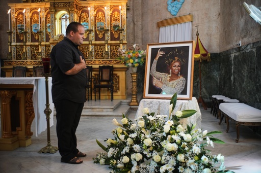 A man stands before a framed image of late singer Celia Cruz after attending a memorial Mass marking the centennial of her birth at the Virgen del Cobre or Our Lady of Charity church in Havana, Tuesday, Oct. 21, 2025. (AP Photo/Ramon Espinosa) A man stands before a framed image of late singer Celia Cruz after attending a memorial Mass marking the centennial of her birth at the Virgen del Cobre or Our Lady of Charity church in Havana, Tuesday, Oct. 21, 2025. (AP Photo/Ramon Espinosa)