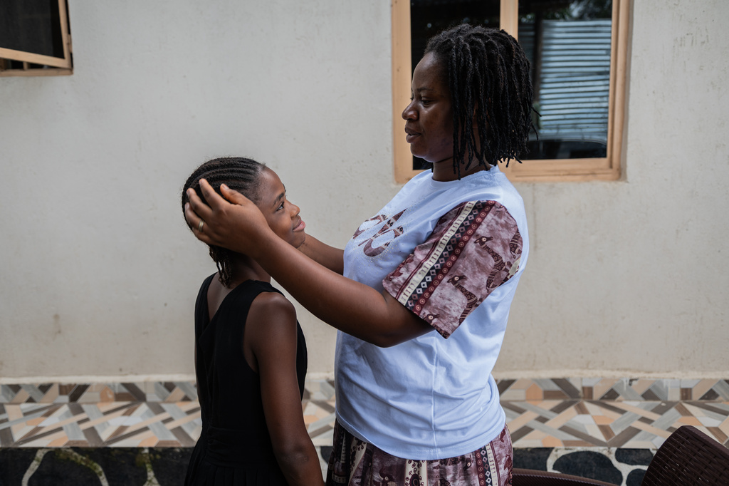 Esther Lutula, a 26 year-old woman who is four months pregnant and a mother of four, who stopped going for prenatal checkups shortly after the current Ebola outbreak, caresses her child outside her house in Bunia, northeastern, Congo, Tuesday, June 16, 2026. (AP Photo/Moses Sawasawa)