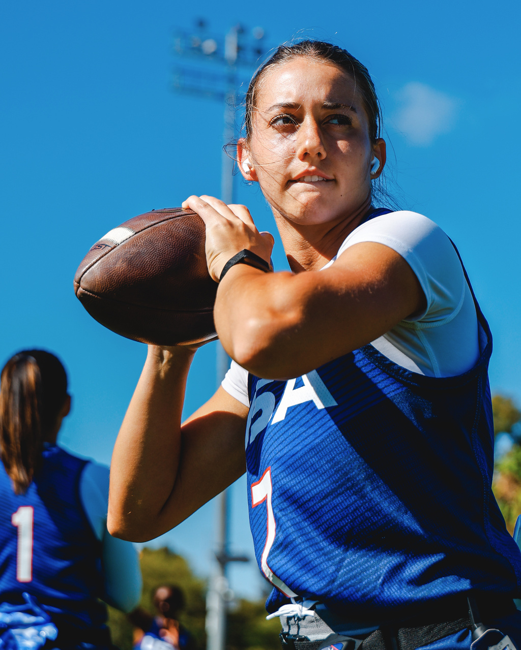 In this image provided by USA Football, USA Football national team player Maci Joncich, who will flag football in the fall and spring at Cal Poly in San Luis Obispo, Calif., warms up before a USA Football's Rivalry Series game against Canada, Sunday, June 19, 2026, at Dignity Health Sports Park in Carson, Calif. (Kelli Tolar/USA Football via AP)