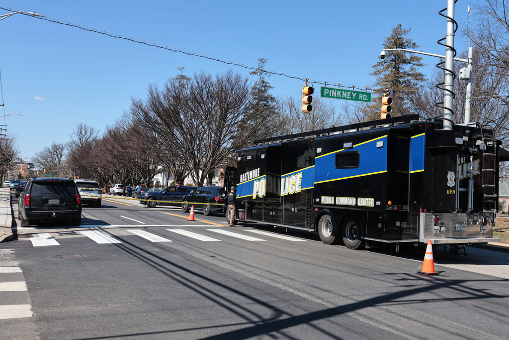 A Baltimore Police mobile command center is seen near the scene of a shooting Tuesday, March 10, 2026, in Baltimore. (AP Photo/KT Kanazawich)