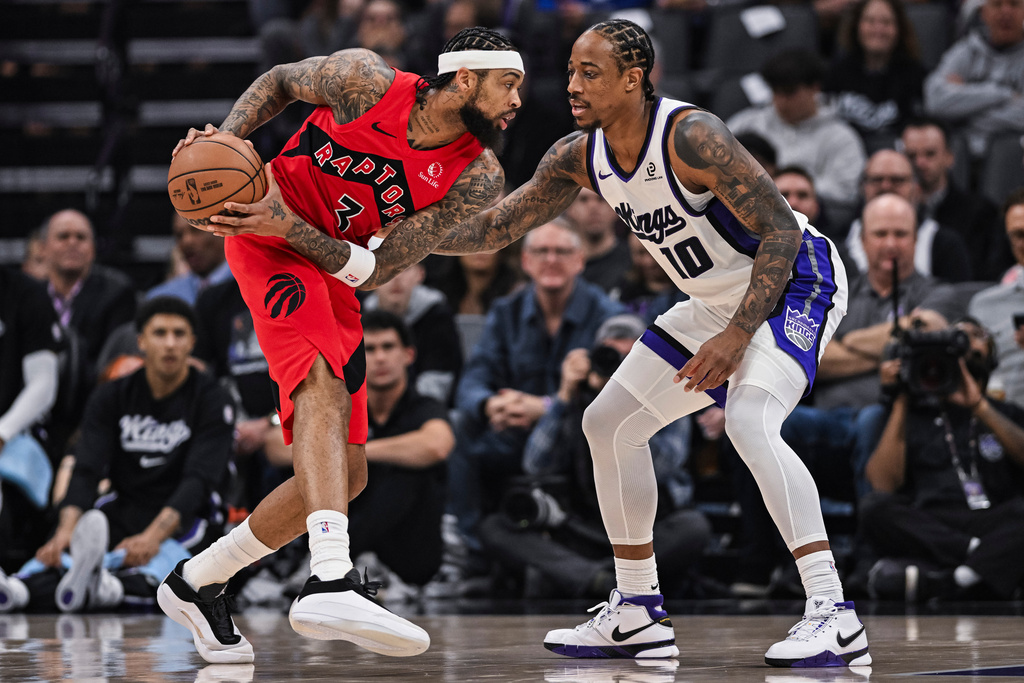 Toronto Raptors forward Brandon Ingram (3) is defended by Sacramento Kings guard DeMar DeRozan (10) during the first half of an NBA basketball game, Wednesday, Jan. 21, 2026, in Sacramento, Calif. (AP Photo/Justine Willard)