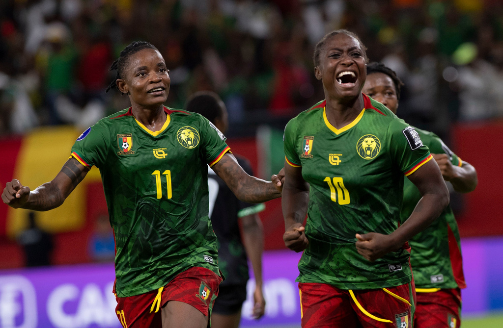 Cameroon's Naomi Leslie Ndjoah Eto, right, celebrates after scoring her team's second goal against Malawi during the Women AFCON 2026 final soccer match, in Rabat, Morocco, Sunday, Aug. 16, 2026. (AP Photo)