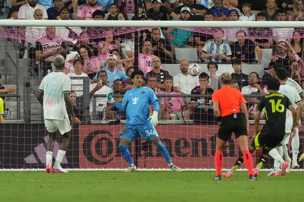Inter Miami goalkeeper Rocco Ríos Novo (34) watches as a kick by Columbus Crew midfielder André Gomes (20) enters the net for a goal during the second half of an MLS soccer match against the Inter Miami, Saturday, Aug. 1, 2026, in Miami, Fla. (AP Photo/Marta Lavandier)