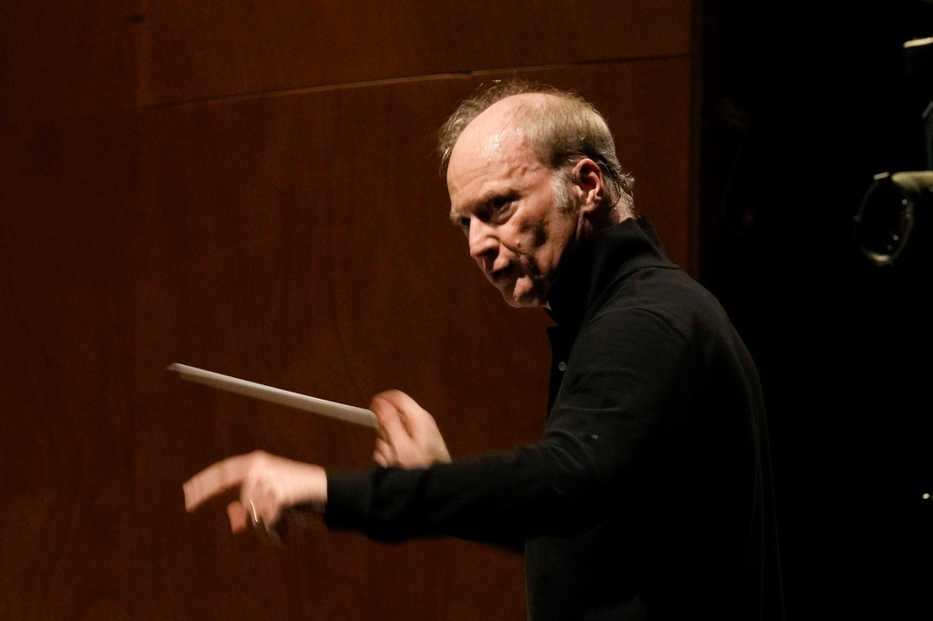 FILE - Music Director of the National Symphony Orchestra (NSO) Gianandrea Noseda conducts the orchestra during a rehearsal at Milan's La Scala theatre, Italy, on Feb. 26, 2024. (AP Photo/Antonio Calanni, File)