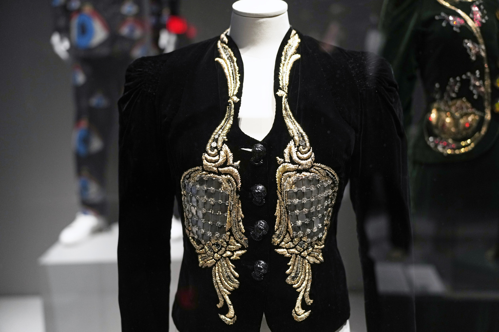 A mirrored dinner jacket by Elsa Schiaparelli is displayed during a press preview for the exhibit "Dress, Dreams and Desire: Fashion and Psychoanalysis" on Tuesday, Sept. 9, 2025, at The Museum at FIT in New York. (Photo by Charles Sykes/Invision/AP)