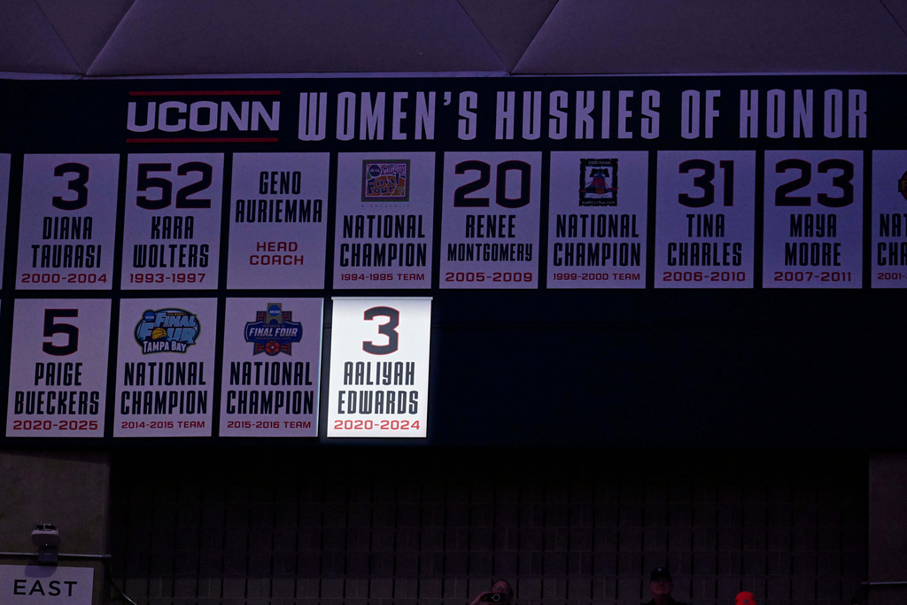 Former UConn player and WNBA player Aaliyah Edwards' number is unveiled during a pregame ceremony adding Edwards to the Huskies of Honor before an NCAA college basketball game against Xavier, Wednesday, Jan. 28, 2026, in Storrs, Conn. (AP Photo/Jessica Hill)