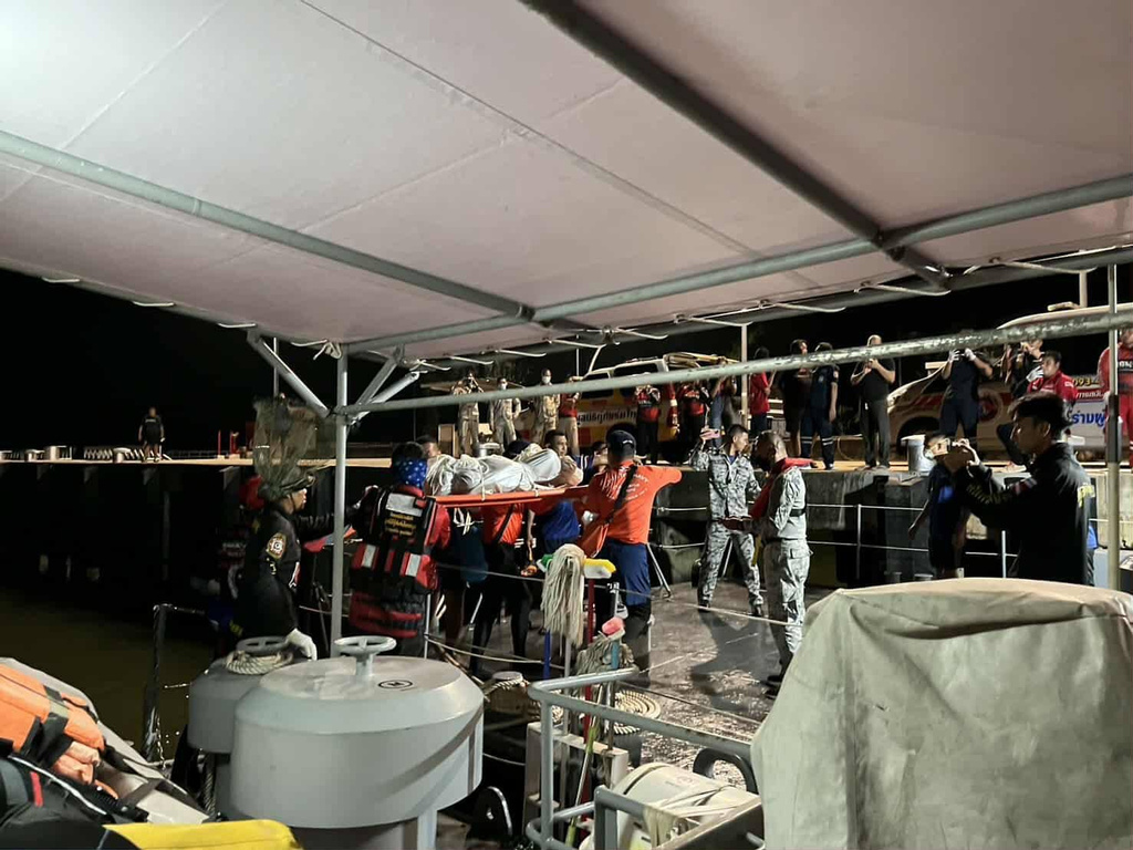 In this image released by Romsai Rescue Foundation Satun, Thai Navy carry a body which is believed to be one of passengers from a boat that believed sank near Tarutao island, Satun, southern Thailand, Sunday, Nov. 9, 2025. (Romsai Rescue Foundation Satun via AP)