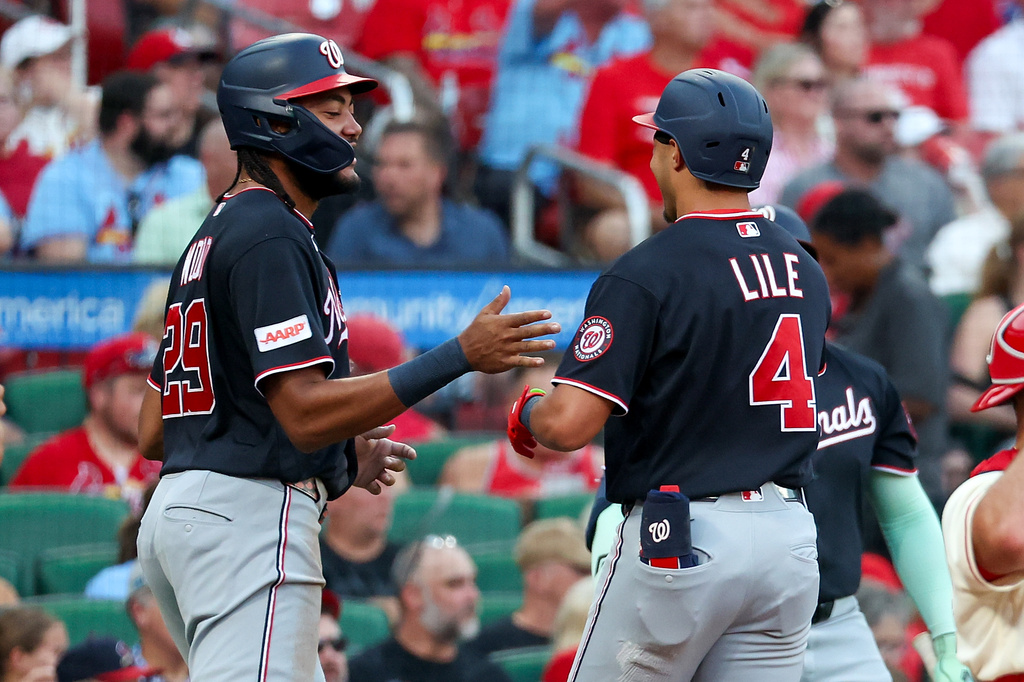 Washington Nationals' James Wood, left, congratulates Daylen Lile on his two-run home run during the first inning of a baseball game against the St. Louis Cardinals Saturday, Sept. 19, 2026, in St. Louis. (AP Photo/Scott Kane)