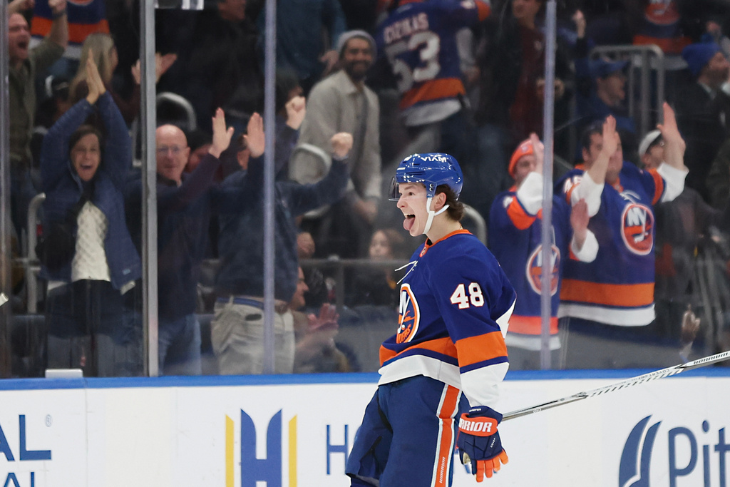 New York Islanders defenseman Matthew Schaefer (48) celebrates his goal during the first period of an NHL hockey game against the Pittsburgh Penguins, Tuesday, Feb. 3, 2026, in Elmont, N.Y. (AP Photo/Heather Khalifa)