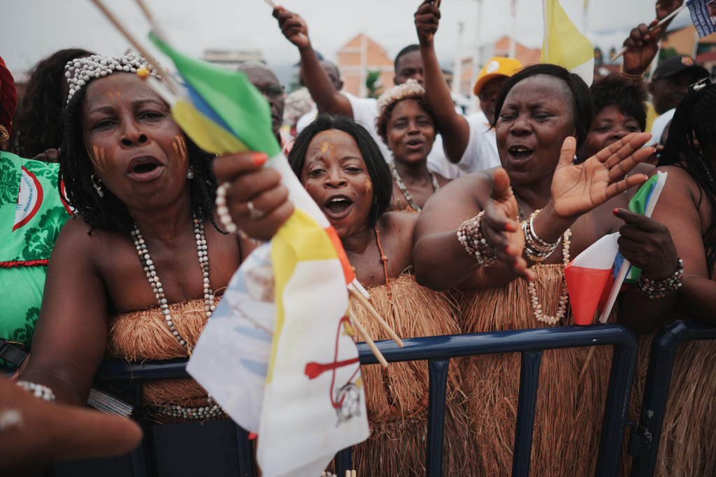 People wait for Pope Leo XIV in Malabo, Equatorial Guinea, Tuesday, April 21, 2026, on the ninth day of his 11-day pastoral visit to Africa. (AP Photo/Andrew Medichini)