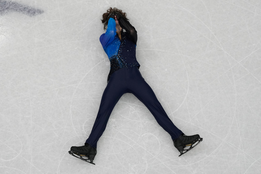 Mikhail Shaidorov of Kazakhstan reacts as he competes during the men's free skate program in figure skating at the 2026 Winter Olympics, in Milan, Italy, Friday, Feb. 13, 2026. (AP Photo/Christophe Ena)