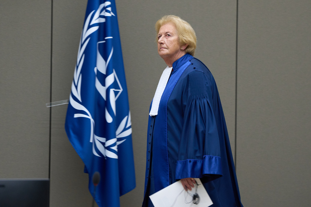 Presiding judge Joanna Korner enters the court room to read the verdict for Ali Muhammad Ali Abd al-Rahman, a leader of the Sudanese Janjaweed militia, at the International Criminal Court, ICC, in The Hague, Netherlands, Tuesday, Dec. 9, 2025. (AP Photo/Peter Dejong, Pool)