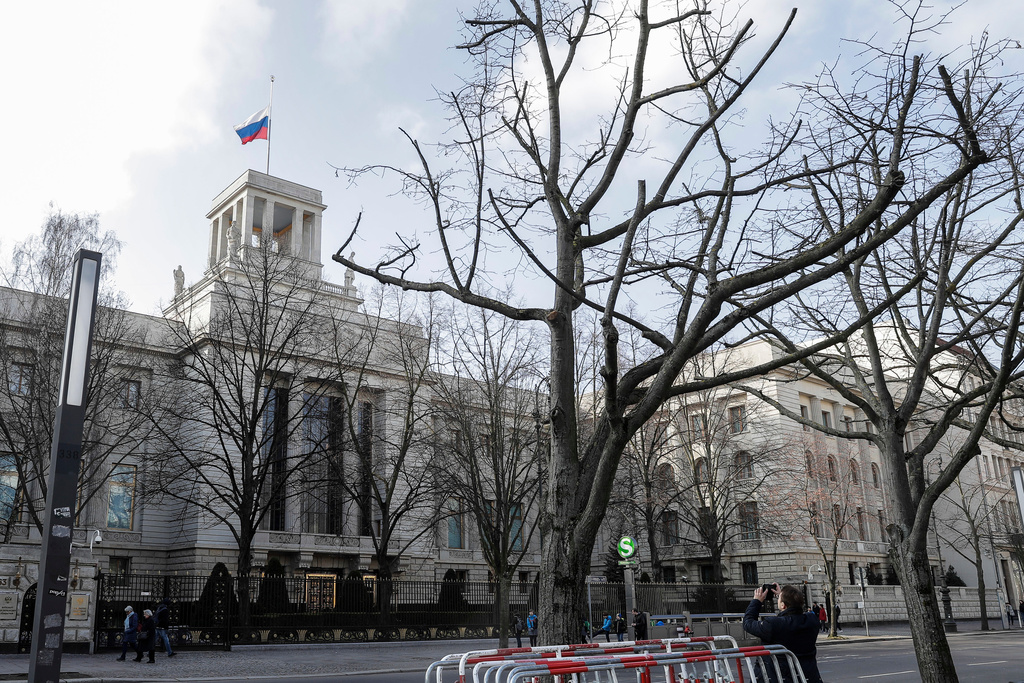 FILE -A man takes a photo of the Russian embassy in Berlin, Germany, Tuesday, March 27, 2018. (AP Photo/Markus Schreiber, File)