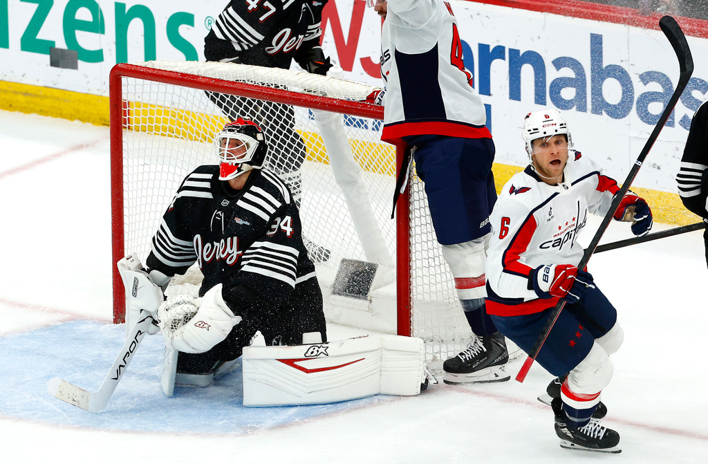 Washington Capitals defenseman Jakob Chychrun (6) reacts after scoring the game winning goal against New Jersey Devils goaltender Jake Allen (34) during overtime of an NHL hockey game, Saturday, Dec. 27, 2025, in Newark, N.J. (AP Photo/Noah K. Murray)