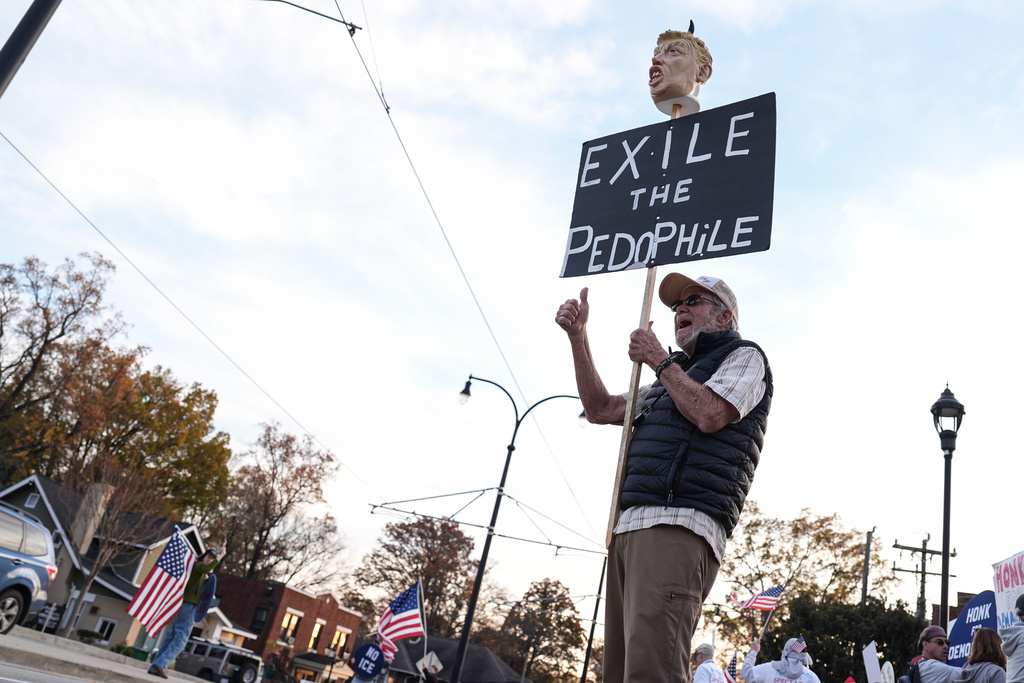 A protester reacts amid the arrival of federal law enforcement, Tuesday, Nov. 18, 2025, in Charlotte, N.C. (AP Photo/Matt Kelley)