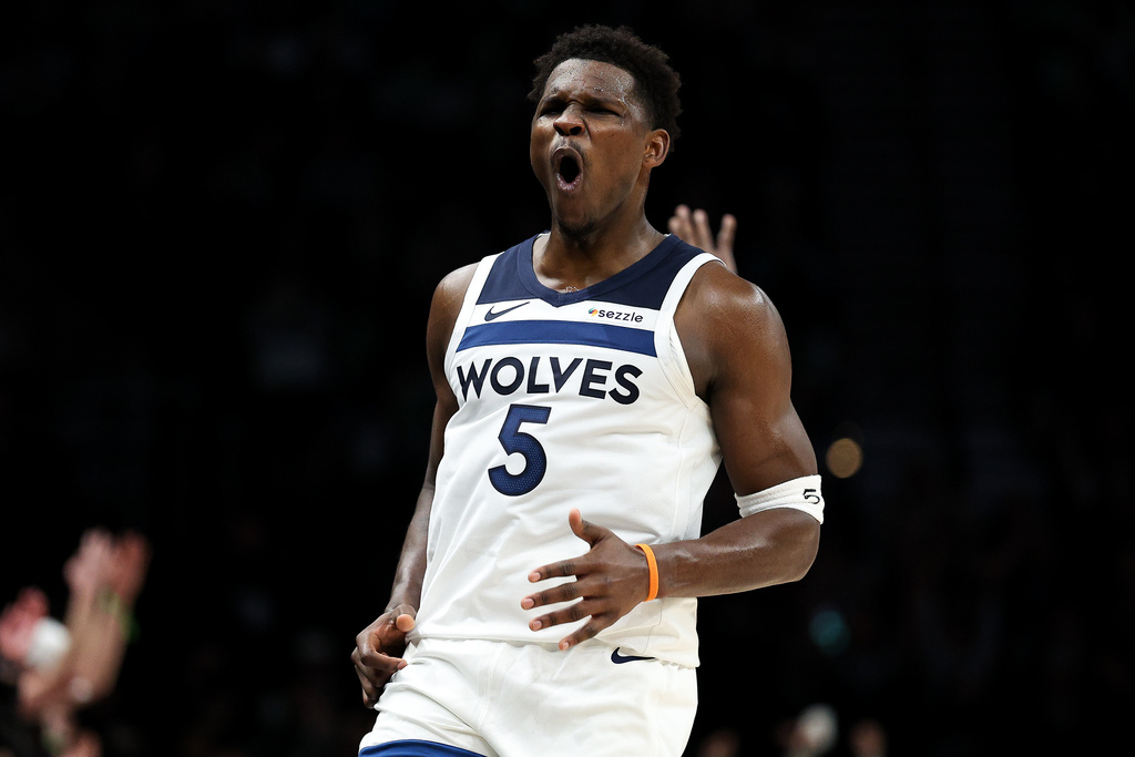 Minnesota Timberwolves guard Anthony Edwards (5) celebrates his three-point basket during the second half of an NBA basketball game against the Cleveland Cavaliers, Thursday, Jan. 8, 2026, in Minneapolis. (AP Photo/Matt Krohn)