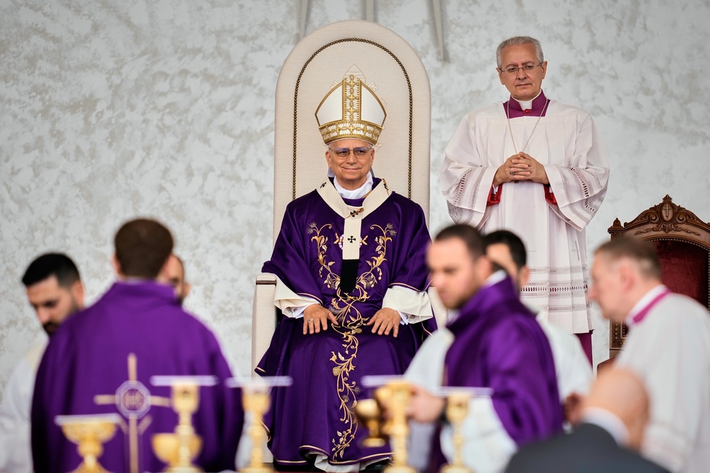 Pope Leo XIV sits as he celebrates a Holy Mass at Beirut waterfront, in Beirut, Lebanon, Tuesday, Dec. 2, 2025. (AP Photo/Bilal Hussein)
