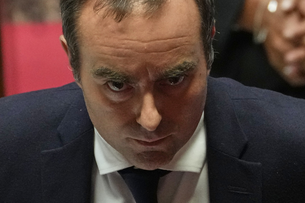 French Prime Minister Sebastien Lecornu answers lawmakers after his policy speech at the National Assembly, Tuesday, Oct. 14, 2025 in Paris. (AP Photo/Thibault Camus)