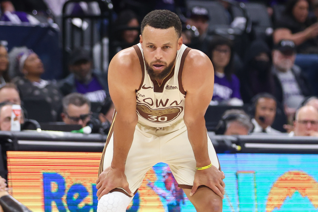 Golden State Warriors guard Stephen Curry looks on during the first half of an NBA basketball game against the Sacramento Kings, Friday, April 10, 2026, in Sacramento, Calif. (AP Photo/Scott Marshall)