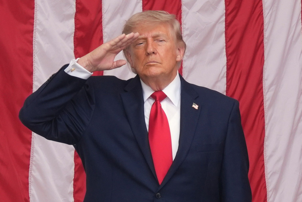 President Donald Trump salutes during the playing of taps at the 158th National Memorial Day Observance coinciding with the nation's 250th anniversary, at the Memorial Amphitheater in Arlington National Cemetery, Monday, May 25, 2026, in Arlington, Va. (AP Photo/Alex Brandon)